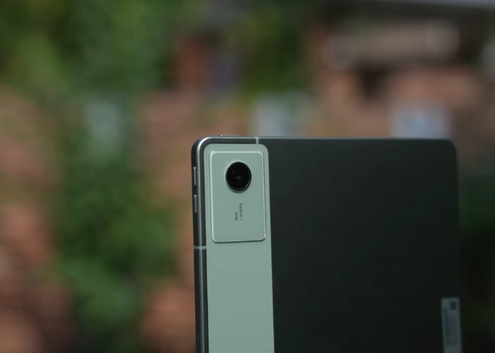 User writing on Moto Pad 60 Neo with included stylus on a study desk