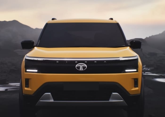 Tata Sierra SUV charging at electric vehicle station highlighting eco-friendly design

